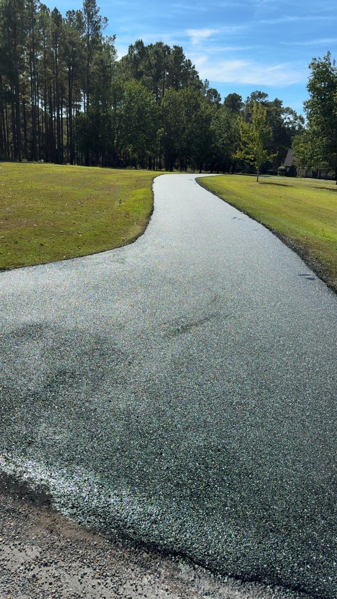 JB Sealcoating finished driveway under blue sky