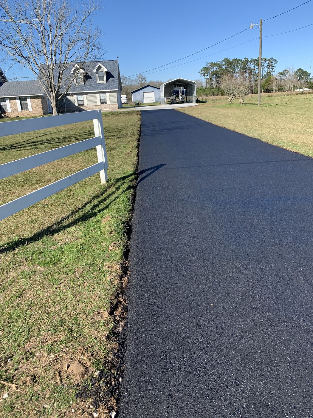 Finished new asphalt driveway at a home