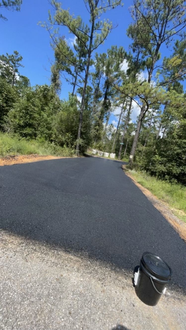 Restored asphalt surface after patching and sealing