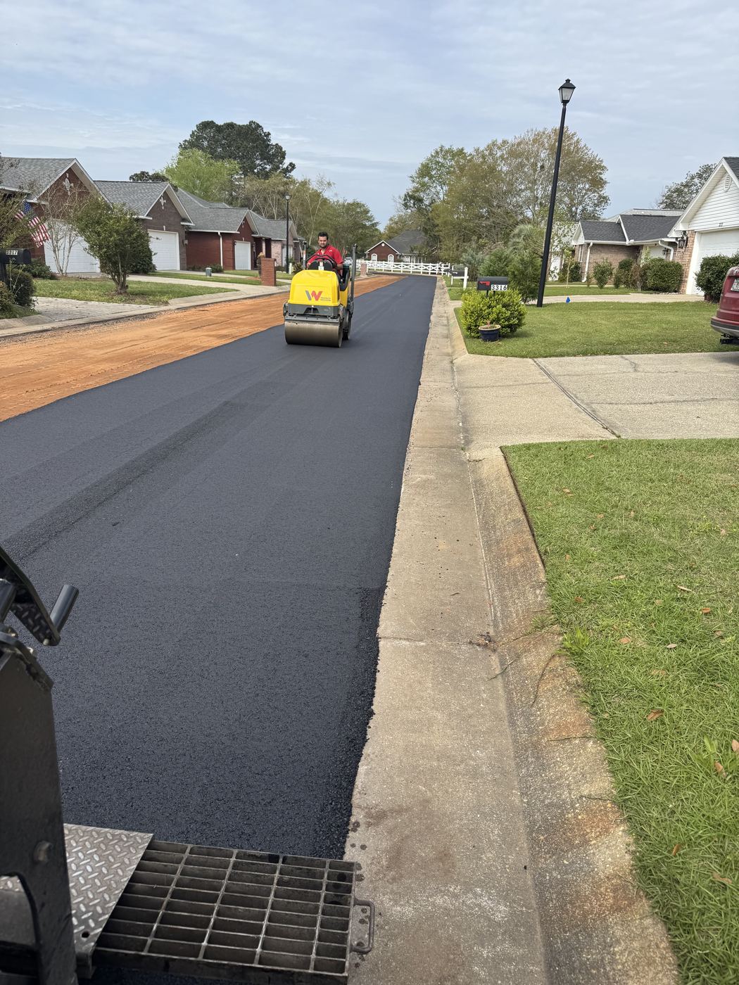 Crew paving a residential street